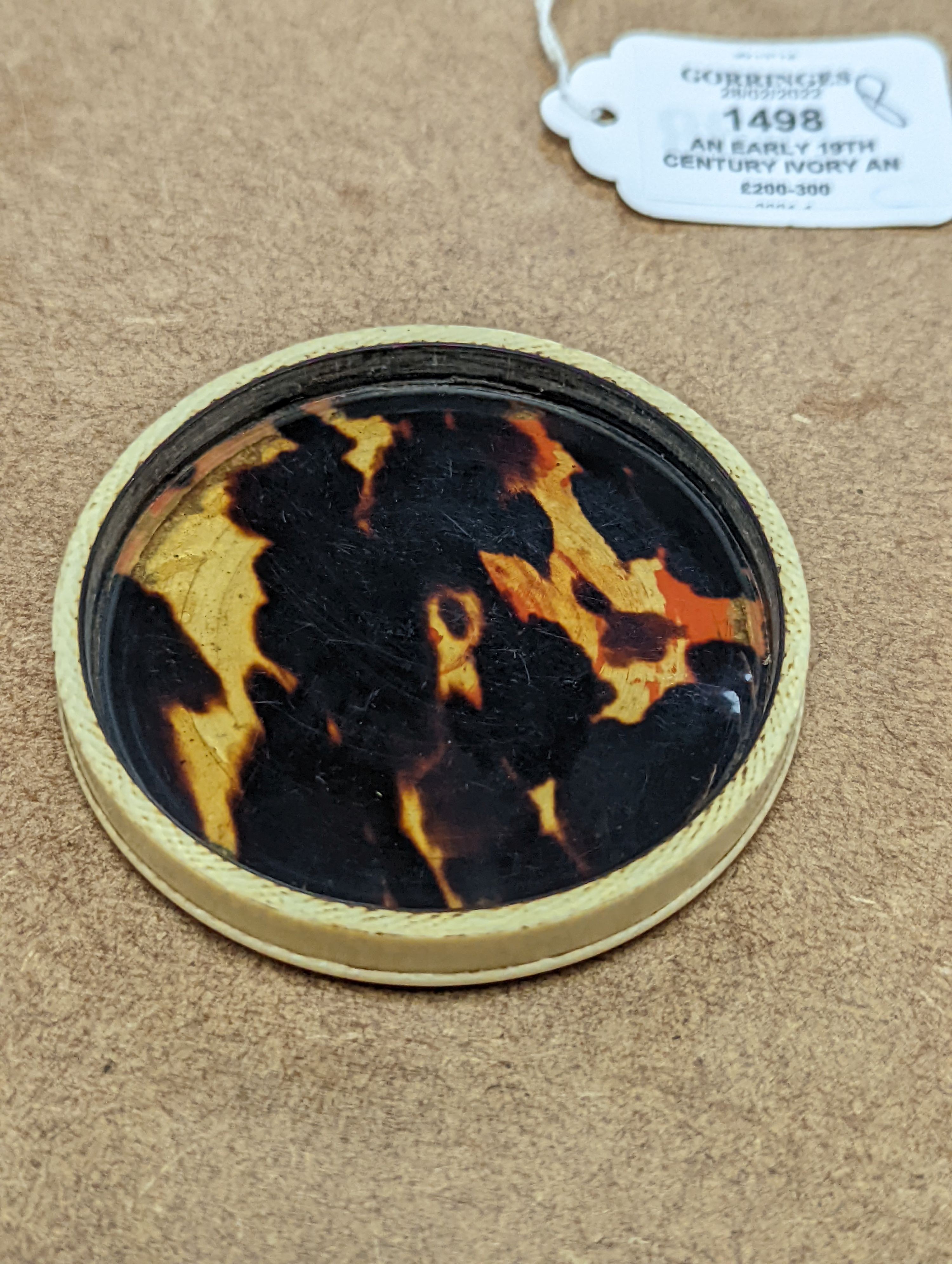 An early 19th century ivory and tortoishell box with inset miniature of Themis to cover, 8cm.